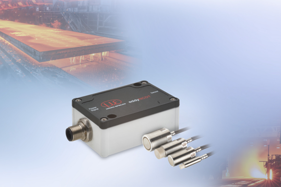 Eddy current controller and sensors set against a backdrop of hot metal production